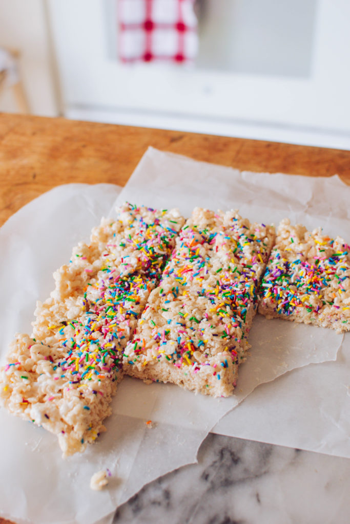 A delicious batch of Funfetti Rice Krispie Squares - in this recipe, we're giving a classic dessert a colourful makeover. And it's so simple to make!