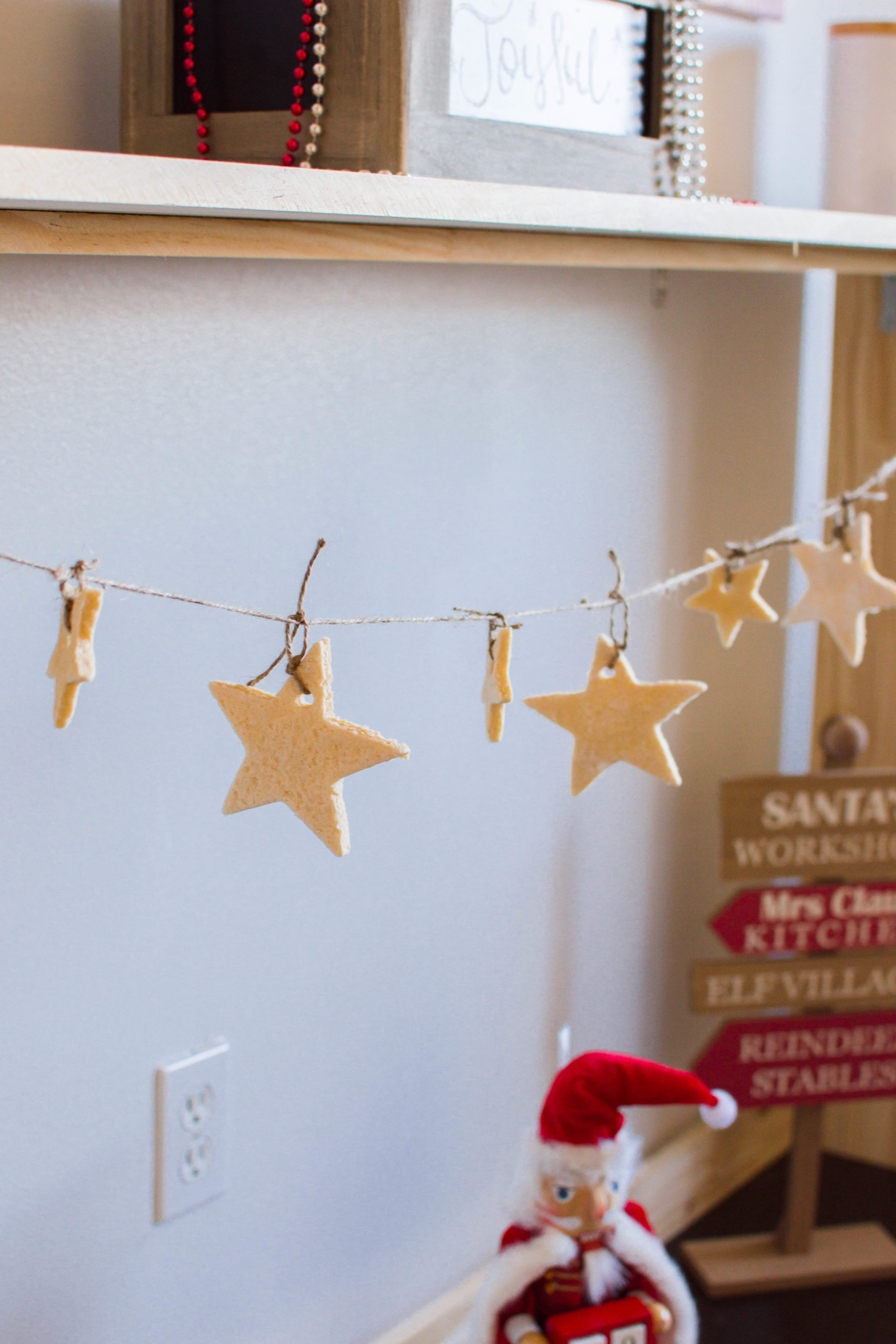 This Christmas Garland is made up of jute cord and our easy salt dough recipe. Such a cute holiday project to make with your kiddos this season!