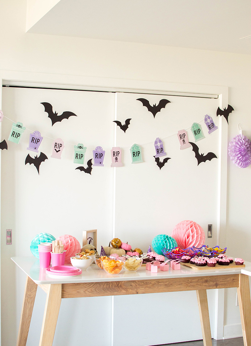 Come celebrate with us as we put together the cutest Pink Halloween Party! We have all the party details – from homemade donuts to pastel décor that made our Pink Halloween Bash a success!