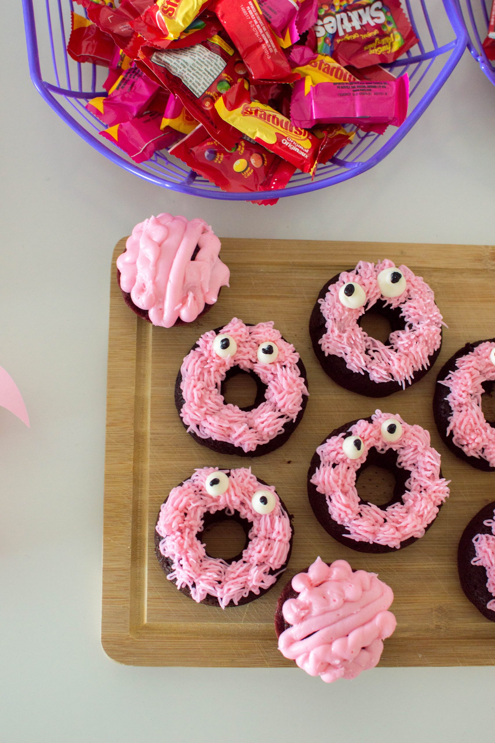 Need some Halloween dessert ideas? These Pink Monster Donuts for Halloween are absolutely delicious and completely homemade. They’re the perfect addition to any Halloween tablescape.