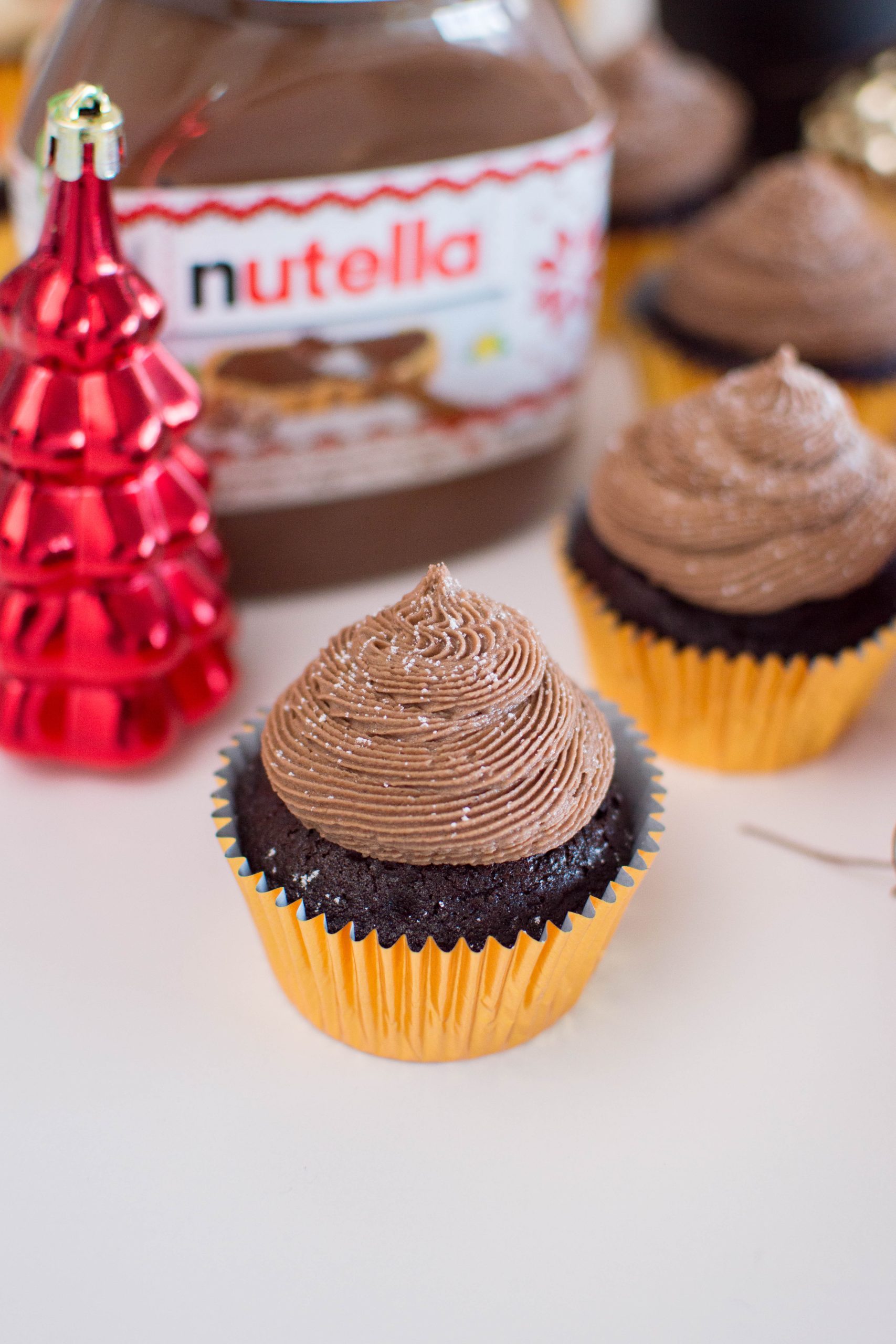 Step-up your cupcake game by topping it with fresh, homemade Nutella Buttercream. It only takes a few minutes to whip-up and is absolutely mouthwatering!